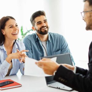 Real estate agent guiding a family through important home selling decisions with clarity and care